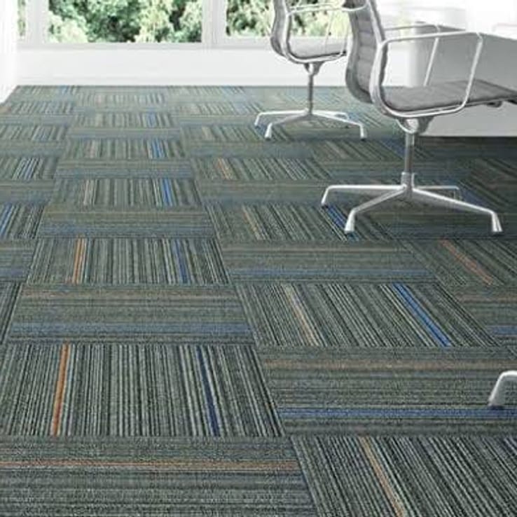 Blue-toned carpet tile flooring in an office walkway