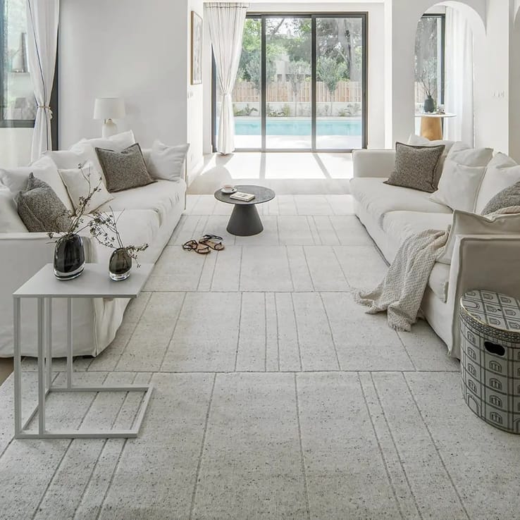 Textured beige carpet flooring in a bright living room
