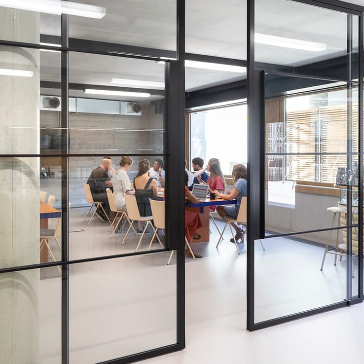 Black-framed glass partition wall for a modern meeting room