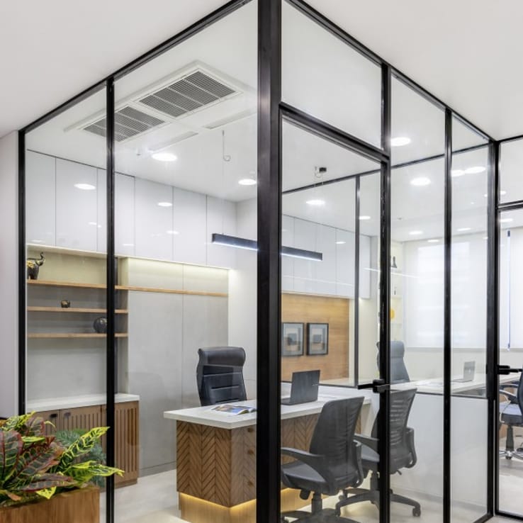 Glass partition office cabin with black aluminium framing