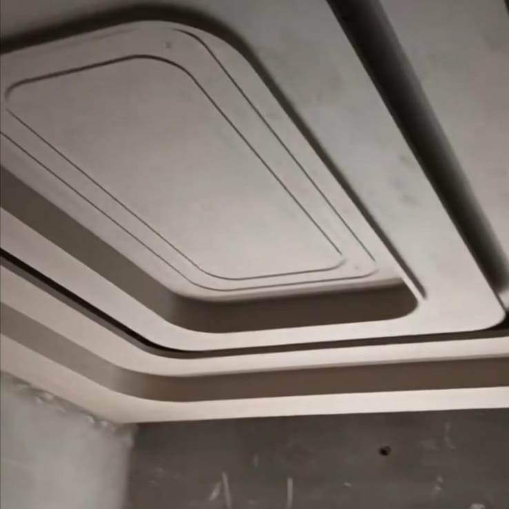Access panel detail in a gypsum ceiling installation