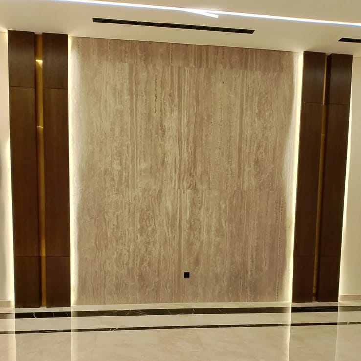 Painted feature wall with natural stone-effect finish