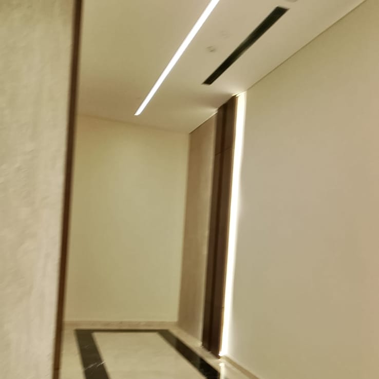 Painted ceiling and wall finish with warm cove lighting