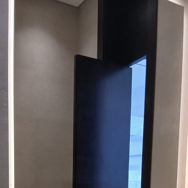 Marble flooring and dark wood door installation, Dubai villa