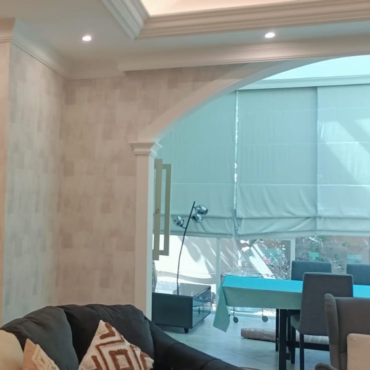 Wallpaper accent wall in a Dubai living room