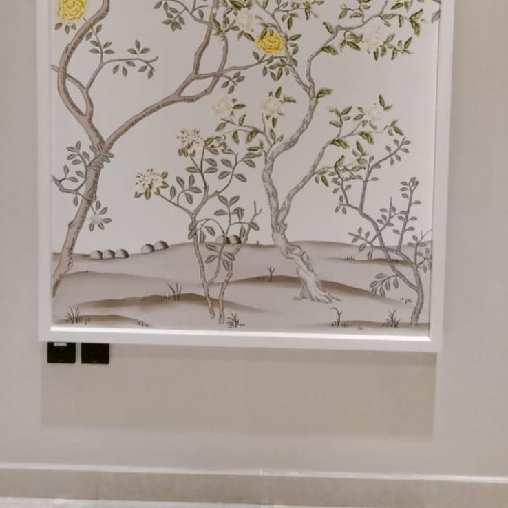 Abstract floral wallpaper installation with cove lighting