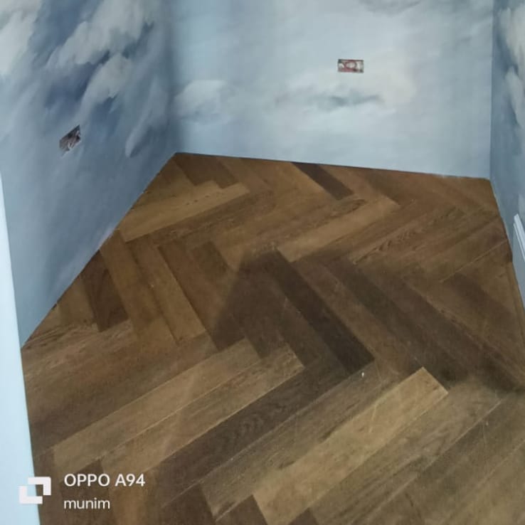 Herringbone wood-effect wallpaper flooring design