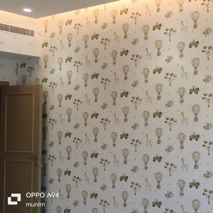 Safari-print wallpaper installed in a child's bedroom